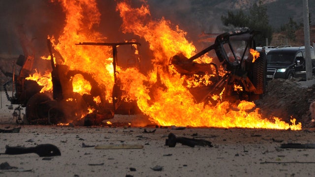 A vehicle burns after an explosion in the center of Tunceli Sept. 25, 2012. 