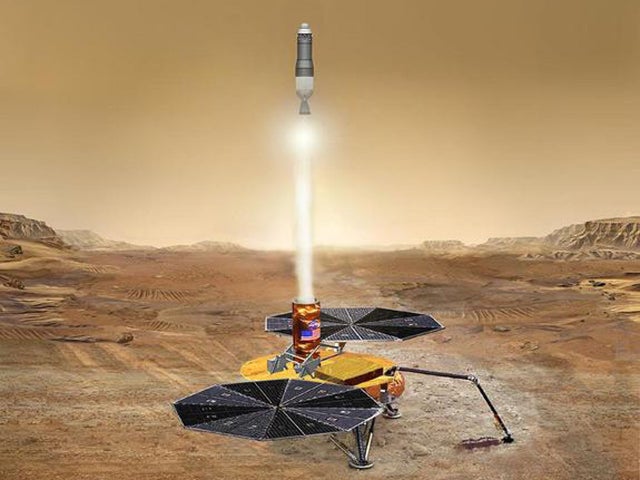 This artist's concept shows a sample of Martian rocks and soil blasting off the Red Planet's surface, destined for scientists' labs here on Earth. 