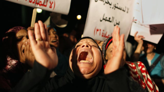An Egyptian woman chants slogans criticizing the Islamist-dominated constitutional assembly 
