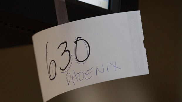 A hand-written flight number appears taped to an  Alaska Airlines computer monitor on October 8, 2012, in Seattle. 