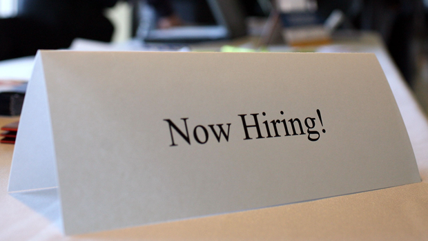 A "now hiring" sign 