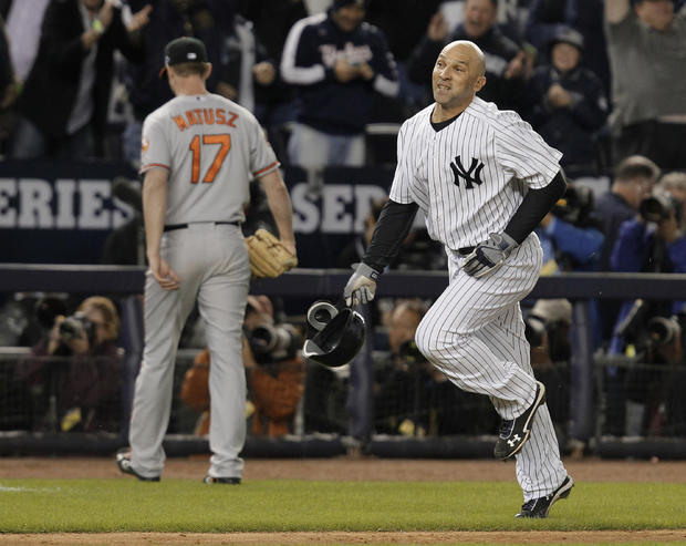 Raul Ibanez runs past Baltimore Orioles pitcher Brian Matusz after hitting the game-winning home run  