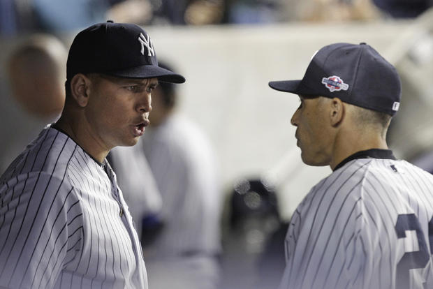 Alex Rodriguez, left, talks to manager Joe Girardi during the 10th inning 