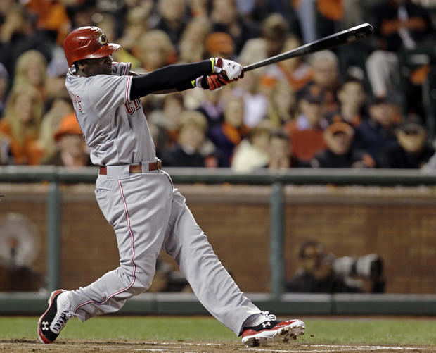 Brandon Phillips swings on a two-run home run in the third inning  