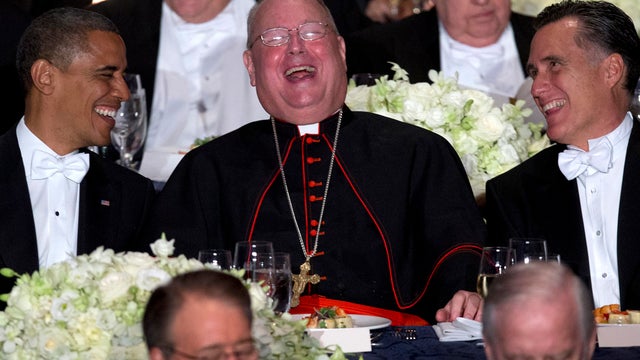 President Barack Obama, left, and Republican presidential candidate, former Massachusetts Gov. Mitt Romney, right, laugh with Cardinal Timothy Dolan during the Archdiocese of New York's 67th Annual Alfred. E. Smith Memorial Foundation Dinner, Thursday, Oc 