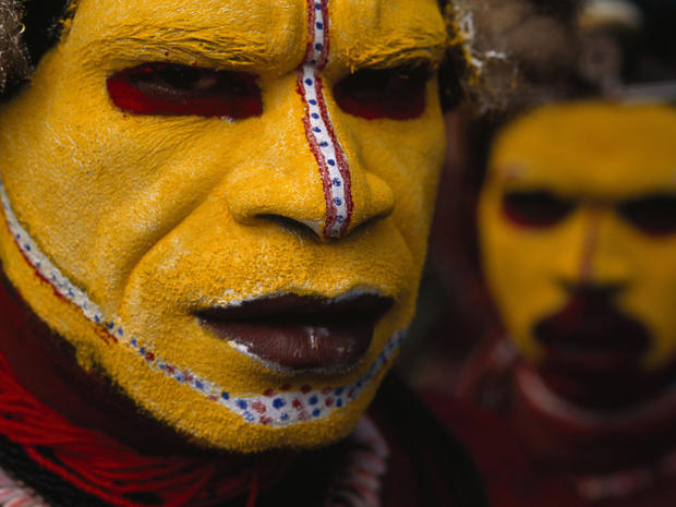 In this 1998 photo provided by National Geographic via Christie's Auction House, Huli Tribesman, in Papua New Guinea are shown. The photo is among a small selection of the National Geographic Society's most indelible photographs that will be sold at Chris 