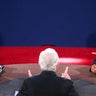 Image from third and final presidential debate shows moderator Bob Schieffer, of CBS News, with back to camera, Mitt Romney on left and President Obama on right  