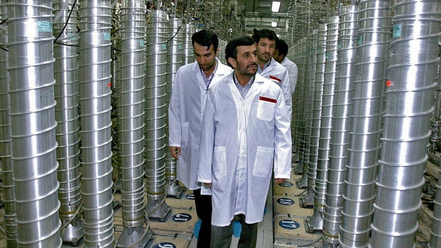 Iranian President Mahomoud Ahmidenijad tours a uranium enrichment site. 