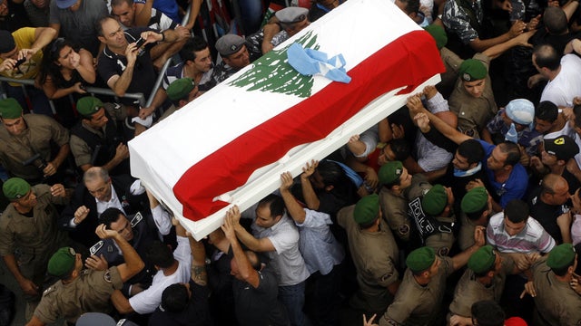 The coffin of assassinated top intelligence officer Brig. Gen. Wissam al-Hassan arrives in downtown Beirut during his funeral procession Oct. 21, 2012. 