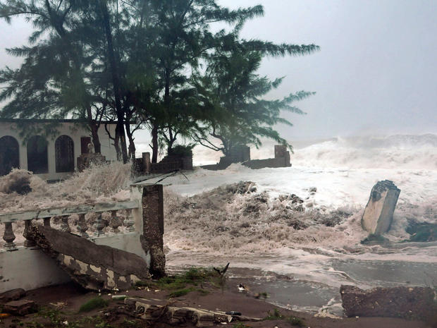 Waves brought by Hurricane Sandy crash on house in eastern Kingston, Jamaica, Wednesday. Sandy's remnants could combine with winter storm and blast of frigid air to bring hybrid super storm to East Coast next week, forecasters say. 