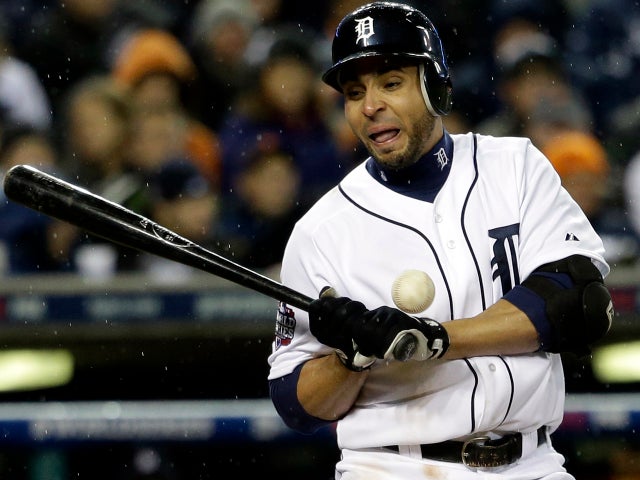 Detroit Tigers' Omar Infante is hit by a pitch during the ninth inning of Game 4 of the World Series against the San Francisco Giants Oct. 28, 2012, in Detroit. 