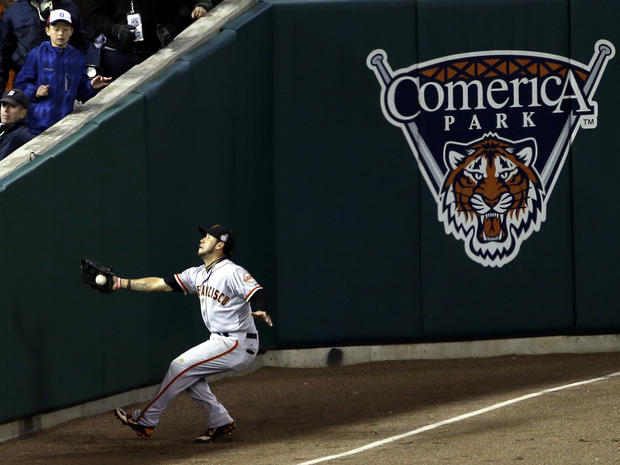 San Francisco Giants right fielder Gregor Blanco makes a catch near the wall of a ball hit by Detroit Tigers' Jhonny Peralta during the ninth inning of Game 3 of the World Series Oct. 27, 2012, in Detroit. 