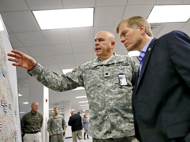 Virginia National Guard Lt. Col. Doug Gagnon from Powhatan, Va., shows Virginia Gov. Bob McDonnell locations of National Guard troops around the state in preparation for Hurricane Sandy at the Virginia Emergency Operations Center in Chesterfield County, V 