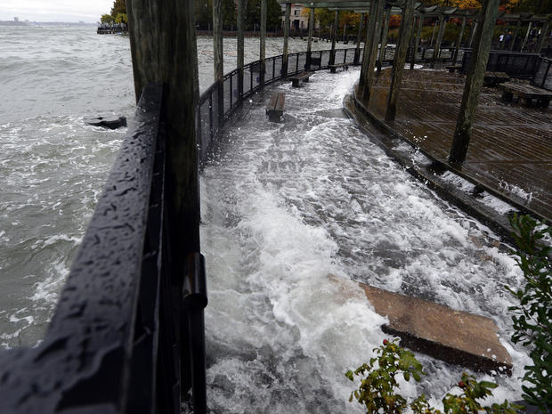 The Hudson River comes over the sea wall along the West Side Promenade in the Battery Park area in New York on October 29, 2012 