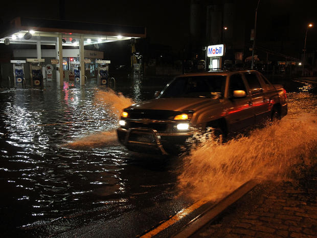 A truck drives by a flooded gas station in the Gowanus section of Brooklyn as Hurricane Sandy affects the area on October 29, 2012 in New York City. 