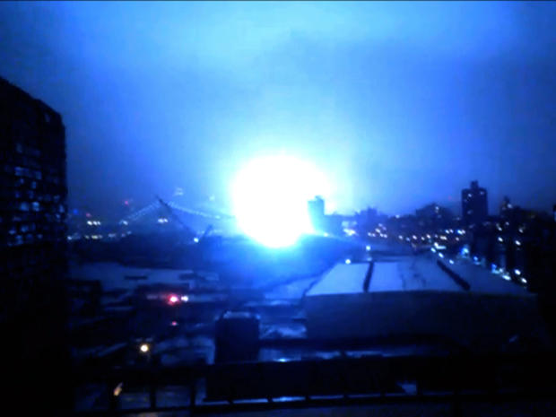 What appears to be a transformer exploding in Lower Manhattan is seen Oct. 29, 2012, from a building rooftop from the Navy Yard in Brooklyn during Sandy 
