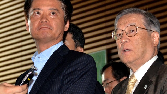 Japanese Defense Minister Satoshi Morimoto, right, and Foreign Minister Kiichiro Gemba speak to the media after a Cabinet meeting at the prime minister's official residence in Tokyo Sept. 19, 2012. 