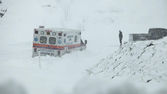 An ambulance is stuck in over a foot of snow off of Highway 33 West, near Belington, W.Va. on Tuesday, Oct. 30, 2012, in Belington, W.Va. Superstorm Sandy buried parts of West Virginia under more than a foot of snow on Tuesday, cutting power to at least 2 