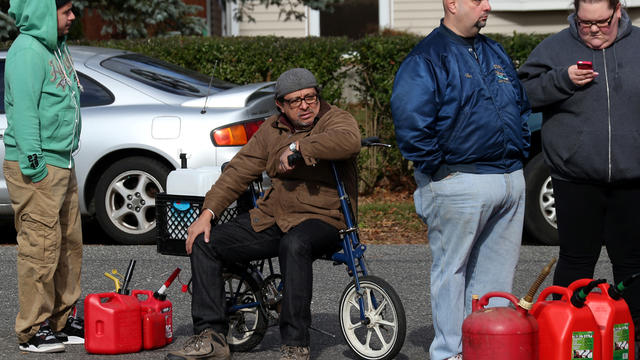People wait in long gas lines at a Valero gas station in the aftermath of Superstorm Sandy Nov. 5, 2012, in Mastic, N.Y. 