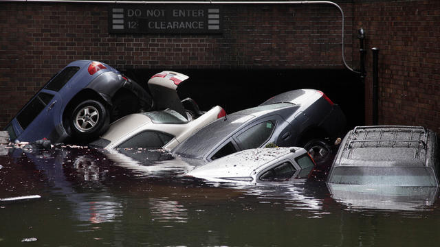 Oct. 30 file photo shows cars submerged at entrance to parking garage in New York's Financial District in the aftermath of superstorm Sandy 