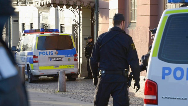This photo shows police outside the Swedish Prime Minister Fredrik Reinfeldt 