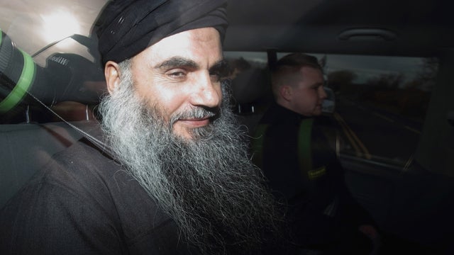 Abu Qatada is driven out of the prison gates after he was released from HMP Long Lartin 