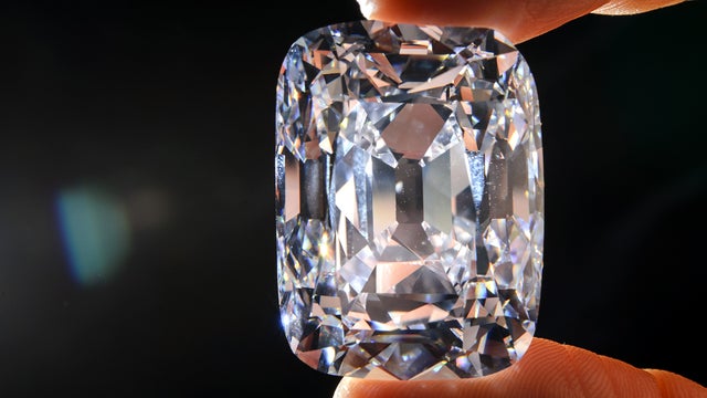 A model holds the Archduke Joseph historical diamond Oct. 3, 2012, during a Christie's auction preview in Geneva. 