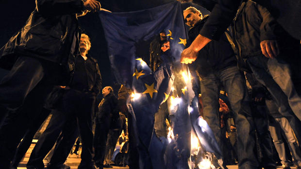 Protesters in Athens, Greece, on March 4, 2010, burn an E.U. flag. 