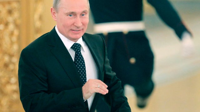 Putin gestures during a meeting with members of the Presidential Human Rights Council in the Kremlin in Moscow 