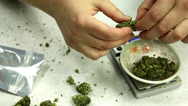 Marijuana is weighed and packaged for sale at the Northwest Patient Resource Center medical marijuana dispensary in Seattle Oct. 10, 2012. 