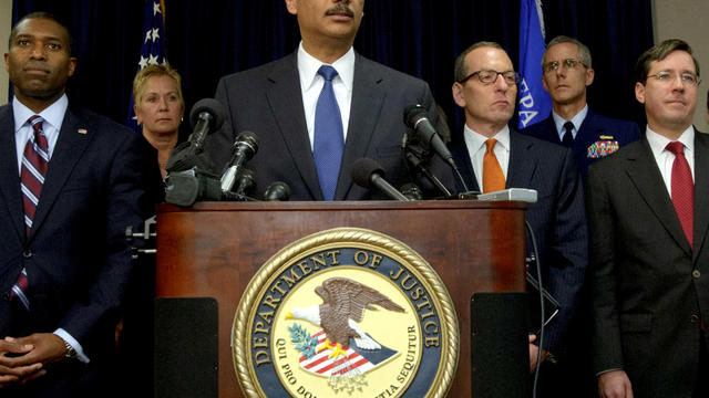 U.S. Attorney General Eric Holder, center, holds a press conference in New Orleans Nov. 15, 2012, with Acting Associate Attorney General Tony West, far left, and Assistant Attorney General for the Criminal Division Lanny A. Breuer, top right, about the 20 