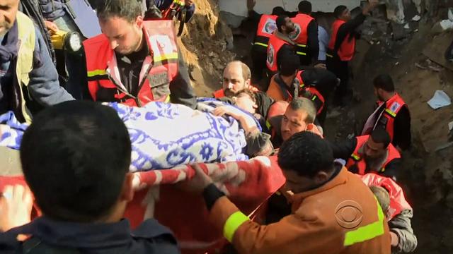 Medical workers in Gaza attend to people wounded by an Israeli air strike on Sunday, Nov. 18, 2012.  