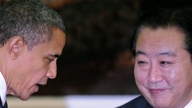 US President Barack Obama (L) greets Japanese Prime Minister Yoshihiko Noda (R) ahead of a family picture ahead of the 7th East Asia Summit in Phnom-Penh on November 20, 2012. US President Barack Obama was set to dive into the tumultuous diplomatic waters 