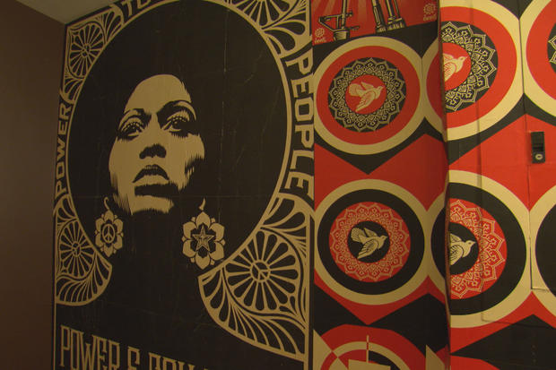 The artist Shepard Fairey created this image of a powerful woman specifically for  Keys' studio hallway. 