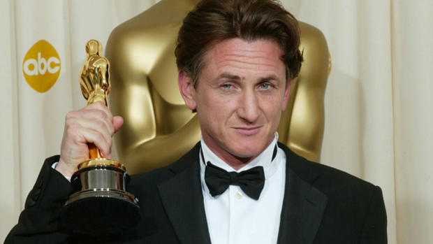Sean Penn hold his Oscar for "Milk" 
