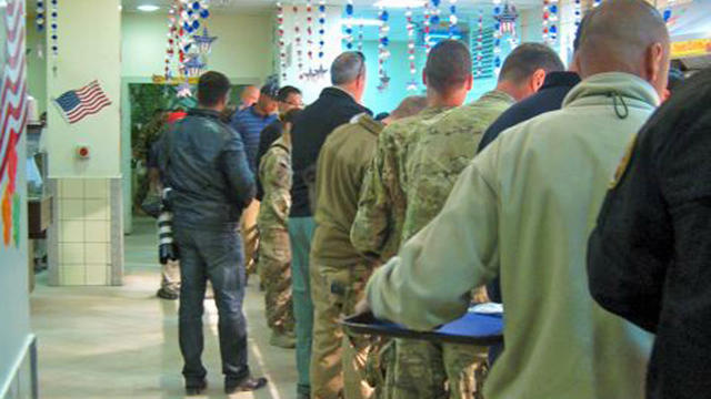 U.S. troops line up for Thanksgiving grub at  Camp Kaia 