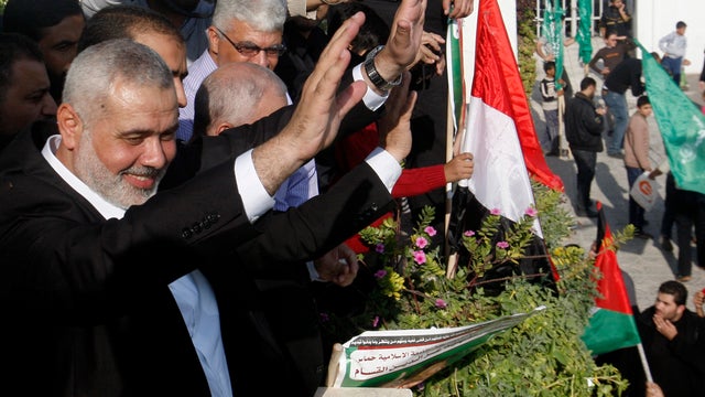 Gaza's Hamas Prime Minister Ismail Haniyeh waves to the crowd during a rally celebrating the Israel-Hamas cease-fire 