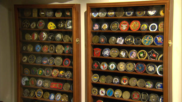 Drew has kept commemorative military coins ever since his first USO trip.  