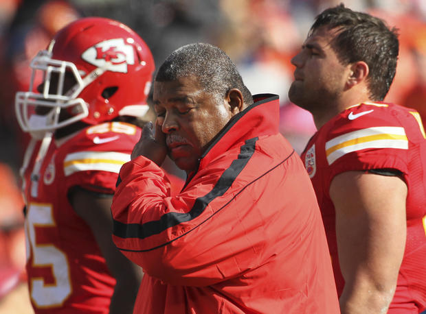 Kansas City Chiefs coach Romeo Crennel wipes his eyes before an NFL football game against the Carolina Panthers at Arrowhead Stadium in Kansas City, Mo., Sunday, Dec. 2, 2012.  