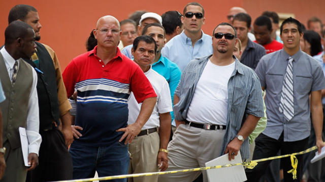 Job seekers line up to apply for an opening with Major League Baseball's Miami Marlins on Nov. 15, 2011, in Miami. 