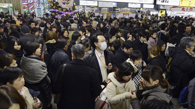 People crowd at Sendai railway station in Sendai, Miyagi Prefecture, Friday, Dec. 7, 2012 after trains were halted following a strong earthquake struck off the coast of northeastern Japan. It is the same region that was hit by a massive earthquake and tsu 