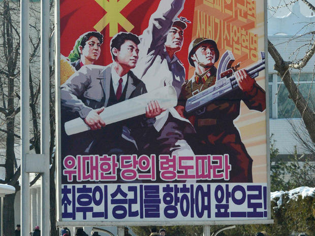 poster with slogan which reads " Advance toward the final victory " in Pyongyang, North Korea Sunday, Dec. 9, 2012.  