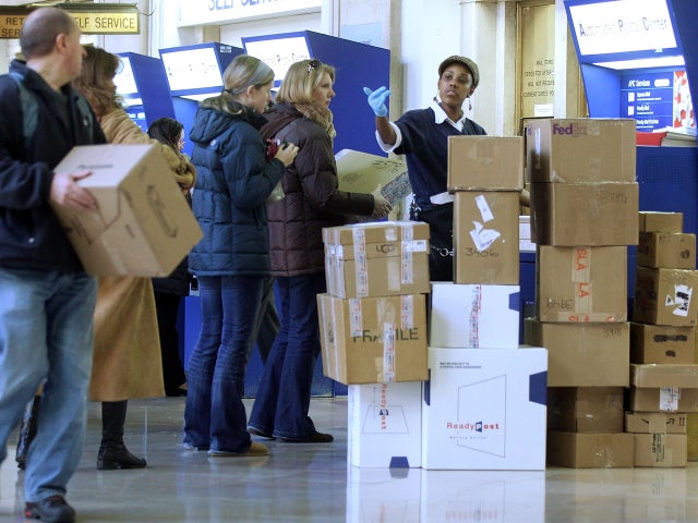 People wait on line to mail packages ahead of the Christmas holiday at the James A. Farley Post Office in Manhattan Dec. 20, 2010, in New York City. 