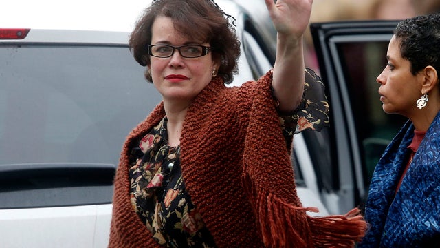 Veronika Pozner waves to the assembled press as she leaves after a funeral service for her son, 6-year-old Noah Pozner, Dec. 17, 2012, in Fairfield, Conn. 
