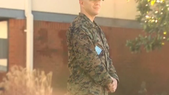 Former Marine Staff Sgt. Jordan Pritchard stands guard at Gower Elementary School in Nashville, Tenn. 