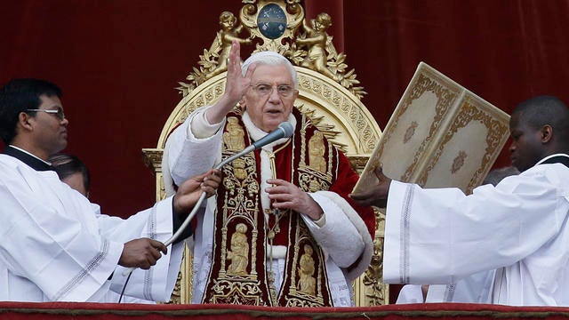 Pope Benedict XVI delivers his "Urbi et Orbi" (to the City and to the World) speech from the central loggia of St. Peter's Basilica, at the Vatican, Tuesday, Dec. 25, 2012. Pope Benedict XVI has wished Christmas peace to the world, decrying the slaughter  