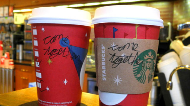 A Starbucks employee writes a message on a cup of freshly brewed coffee at a local store in Washington, DC on December 26, 2012.  