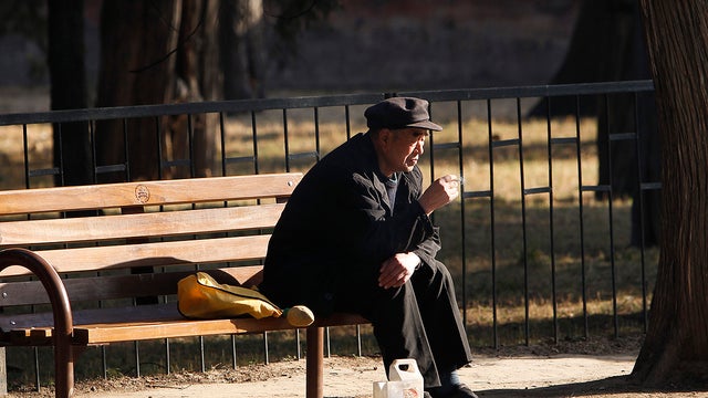In this photo taken on March 17, 2011, an elderly Chinese man sits alone at a park in downtown Beijing.  