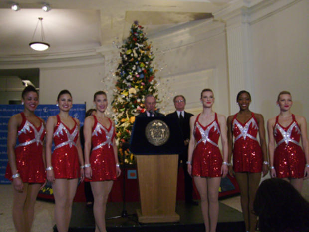 Mayor Bloomberg announcing 2012 tourism figures with the Radio City Rockettes 