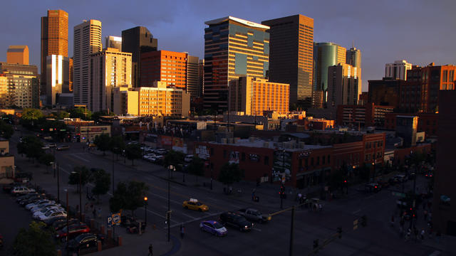 The sun sets on downtown Denver as seen from its LoDo neighborhood May 5, 2012. 